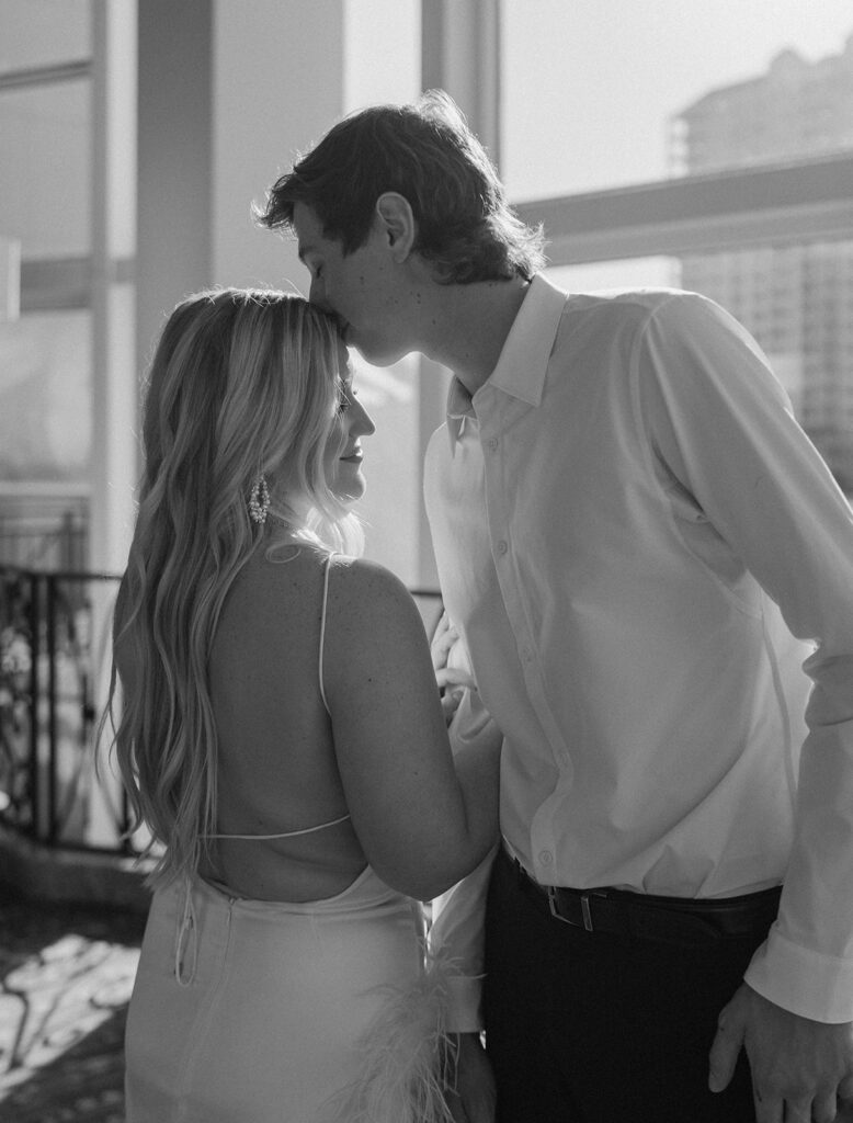 black and white engagement photos couple poses and outfits