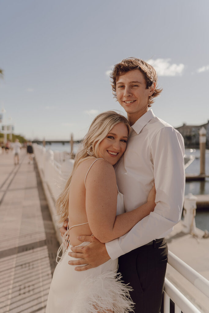 florida engagement photos couple smiling and hugging