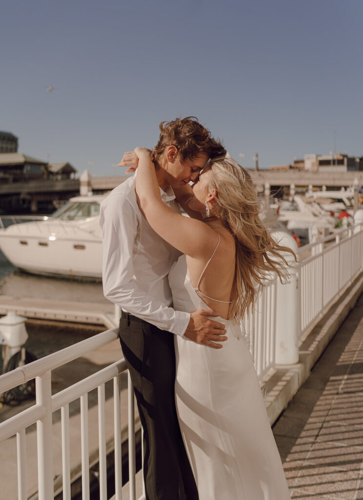 couple kissing on tampa pier during engagement session