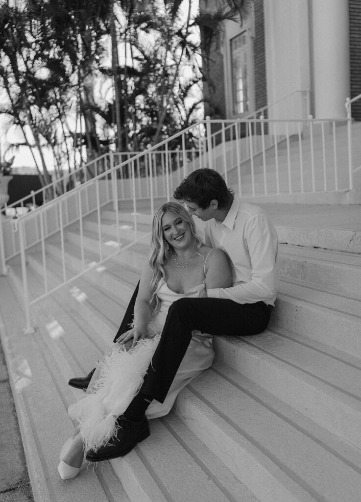 couple posing on stairs tampa engagement photos