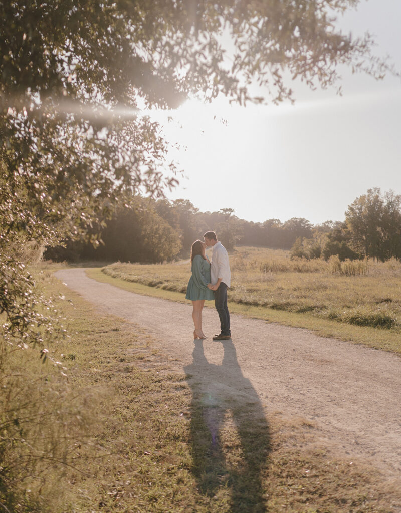 couple kissing during golden hour in florida