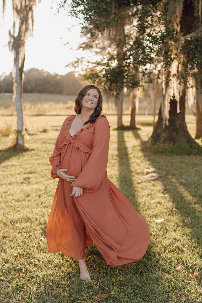 maternity photos mom walking and smiling