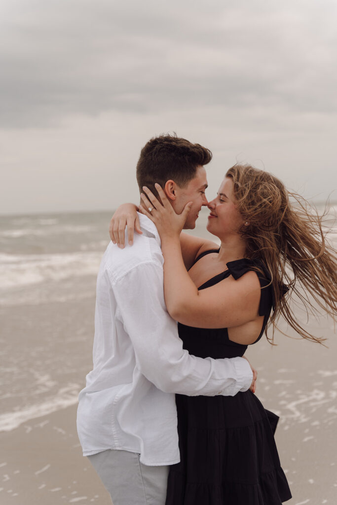 playful engagement photos on the beach in charleston south carolina