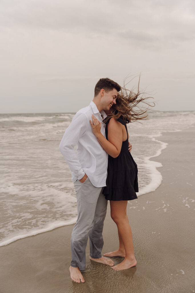 candid proposal photos on the beach