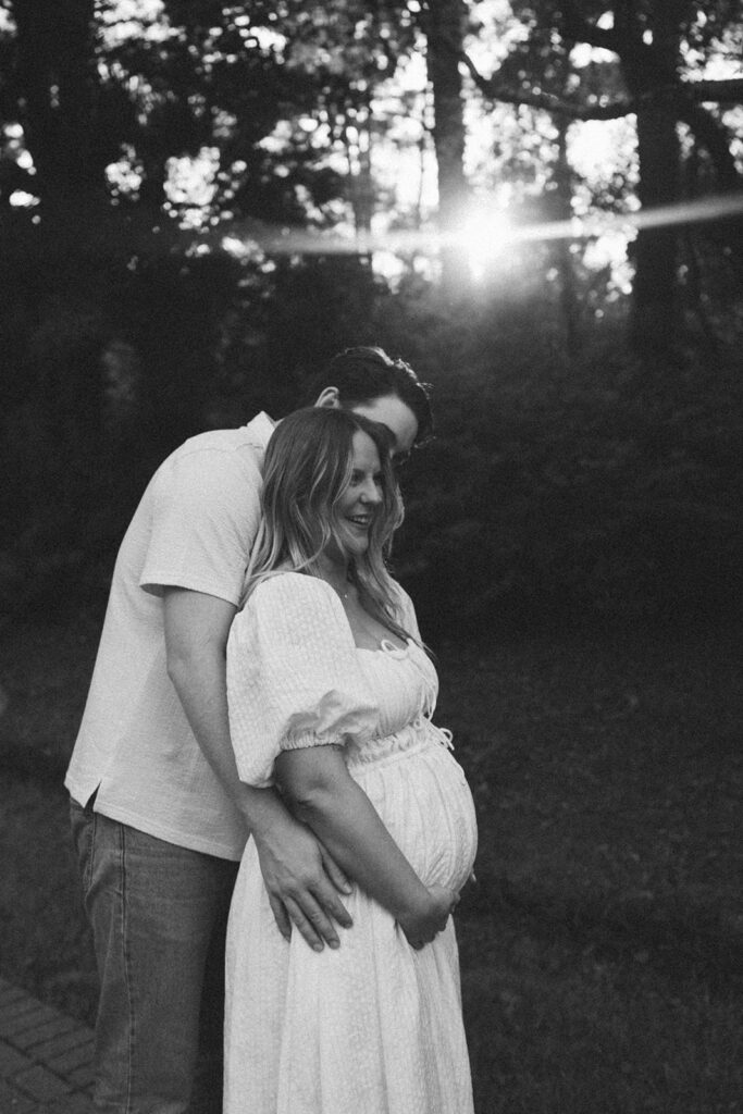 hug from behind maternity pose outdoors florida session