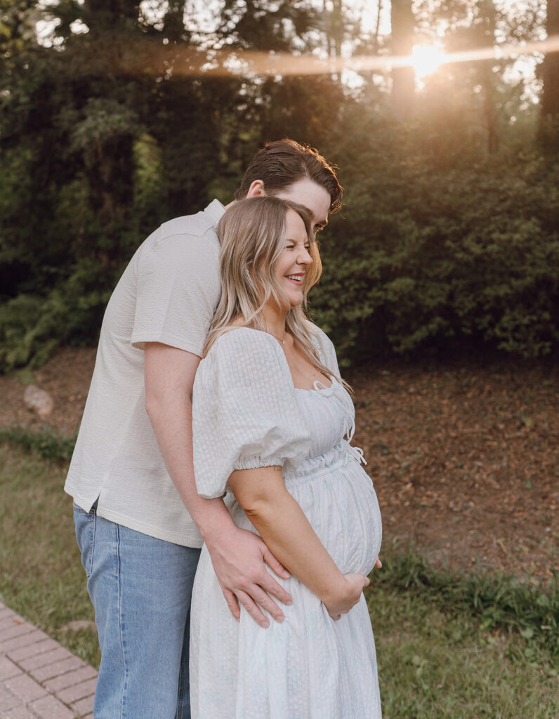 maternity poses baby bump hug from behind