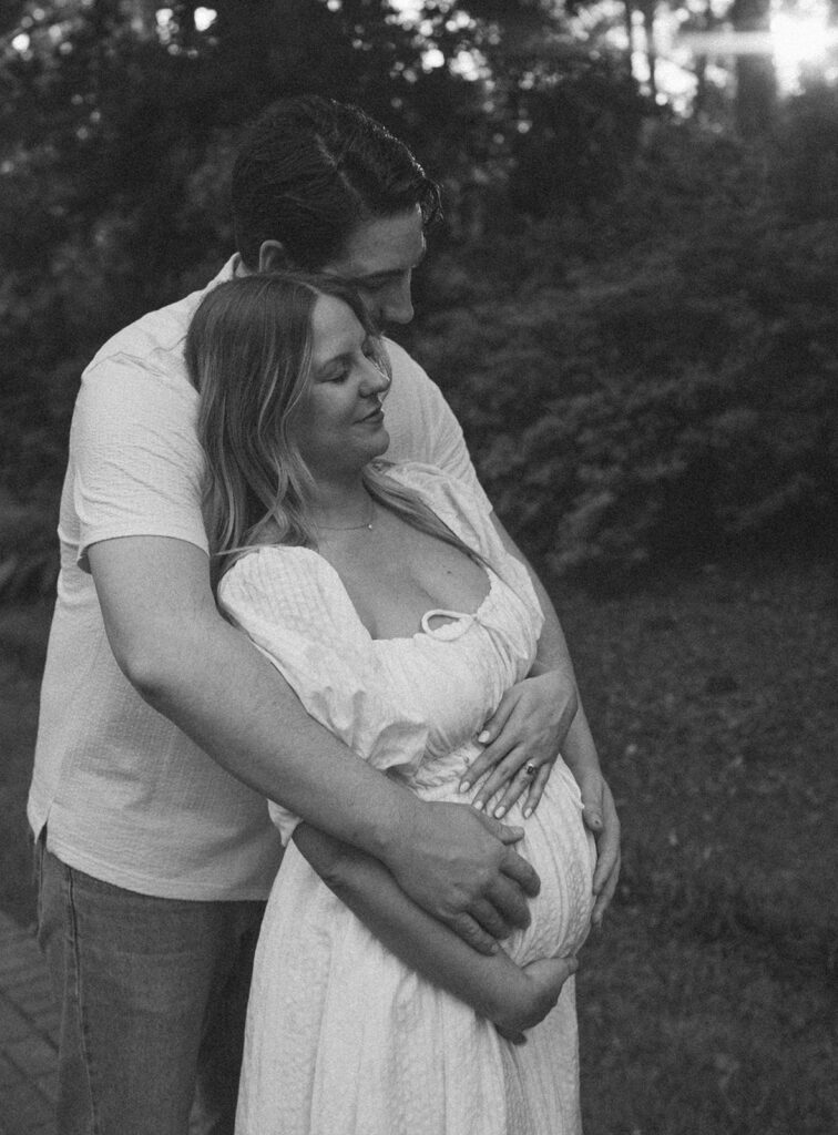 hug from behind maternity pose outdoors florida session