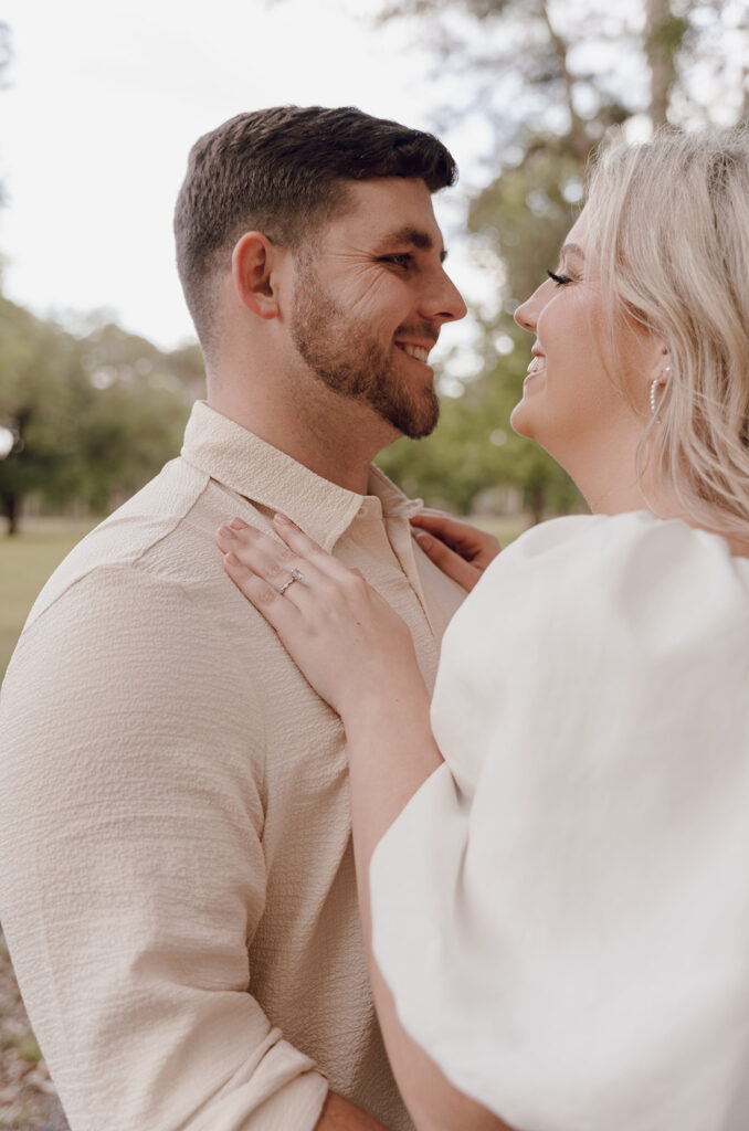 candid and romantic couple poses for florida engagement session