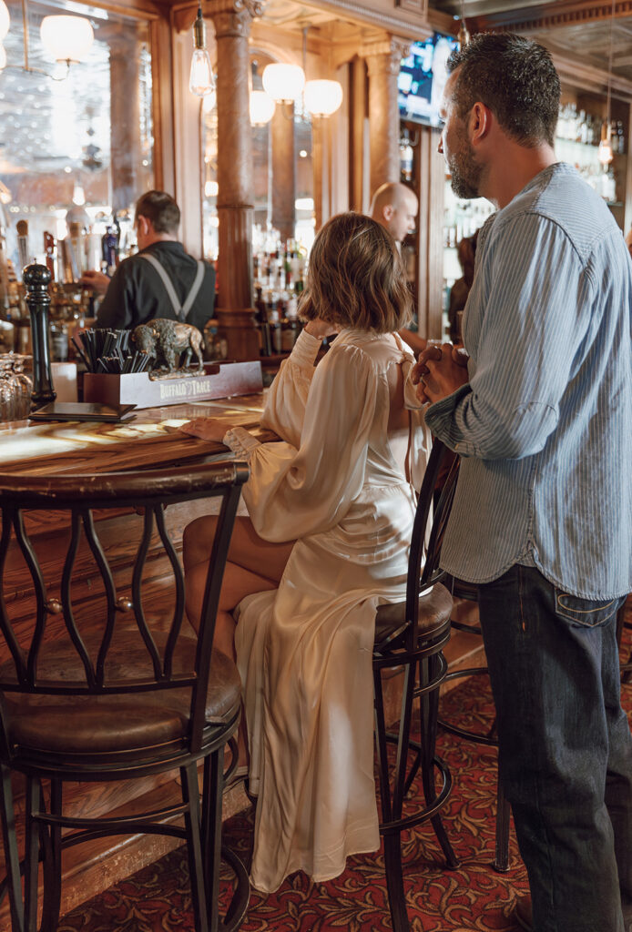 bride and groom at the bar in stanley hotel