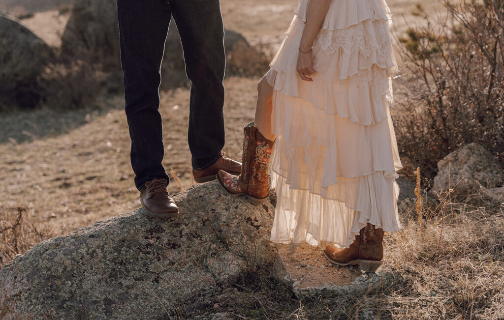 cowgirl boots under wedding dress destination colorado wedding in the mountains