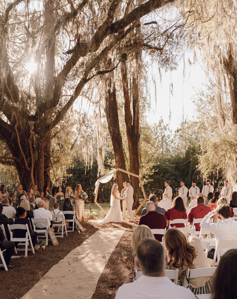 outdoor golden hour wedding ceremony in florida at the homestead barn