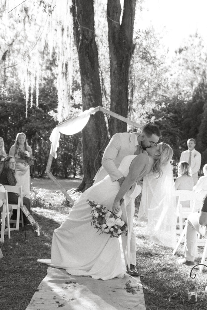 outdoor golden hour wedding ceremony in florida at the homestead barn