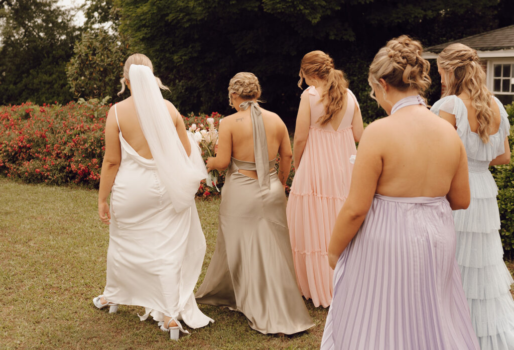 bridesmaids walking with bride spring wedding bridesmaid dresses