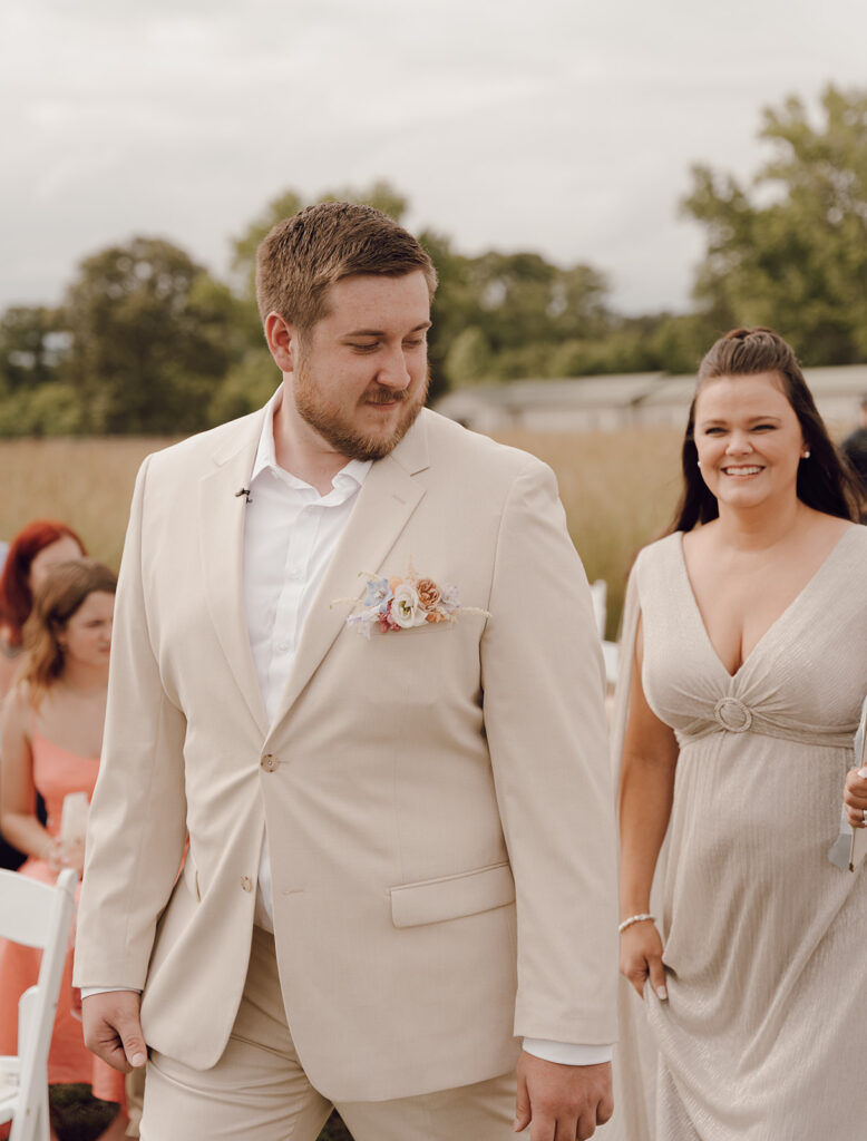 groom walking down the aisle for wedding ceremony