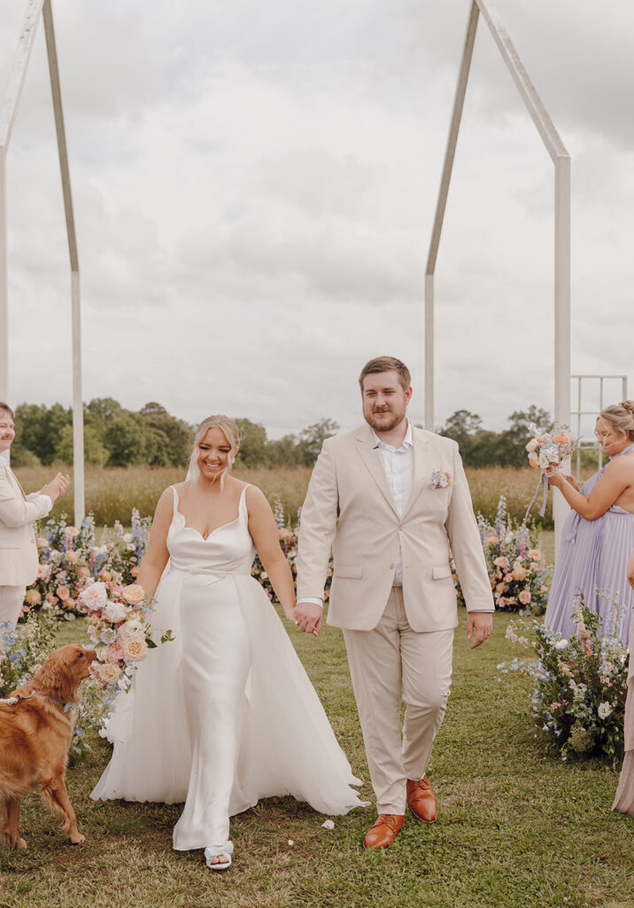 wild daisy farm wedding venue photos bride and groom walking down the aisle