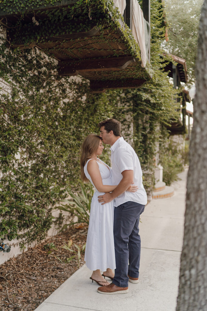 couple poses for florida engagement photos