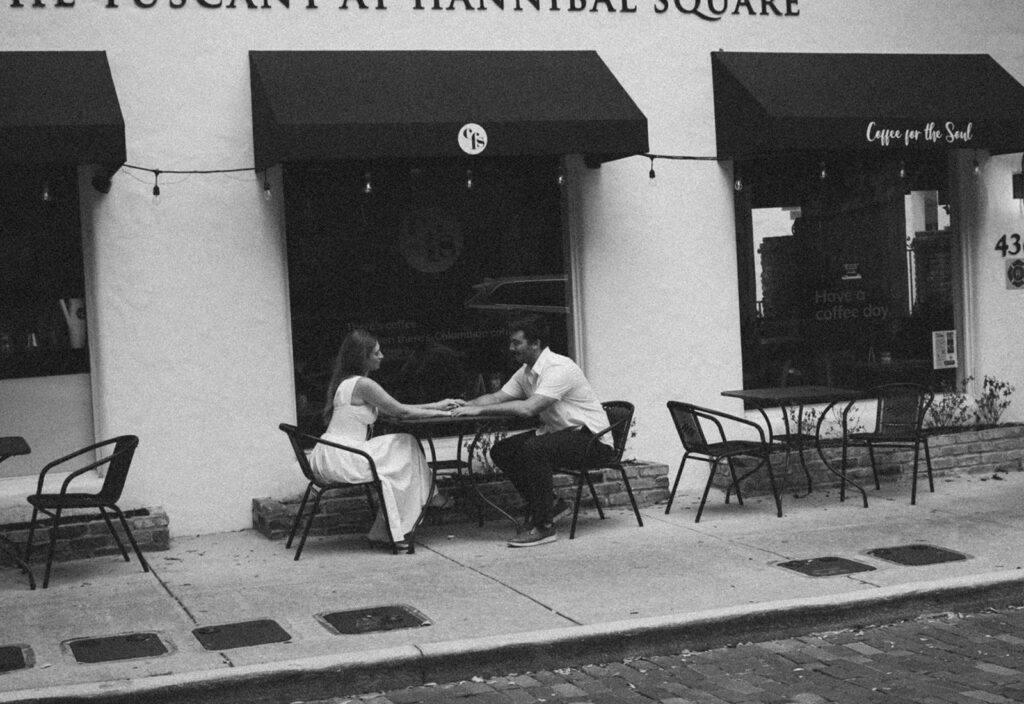 couple outside of coffee shop for florida engagement photos