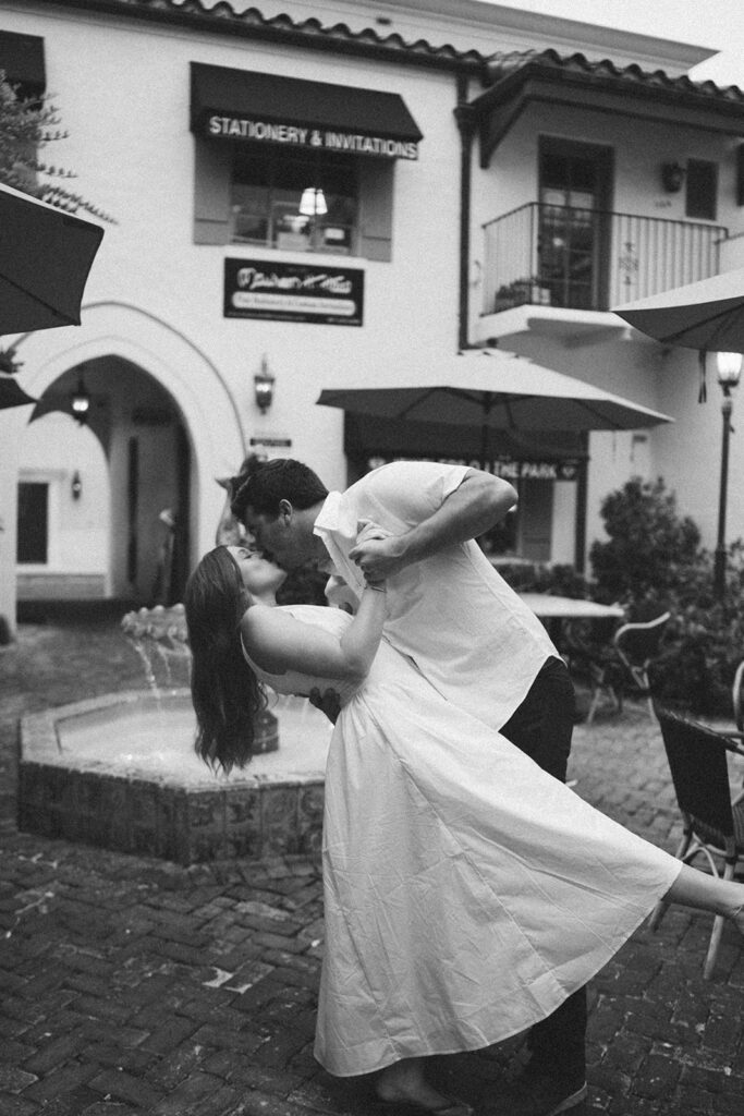 couple kiss dip pose black and white photos