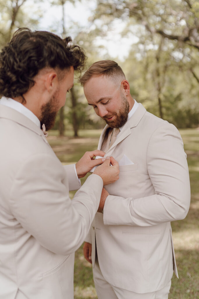 groomsmen getting ready photos outdoor