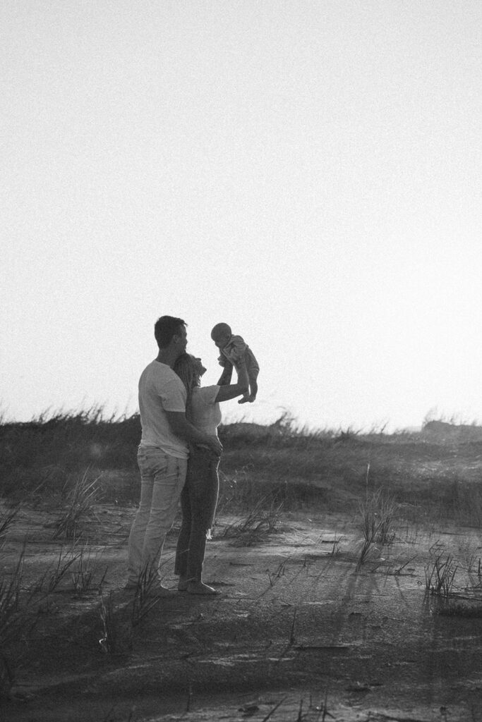 candid newborn photos at the beach in charleston