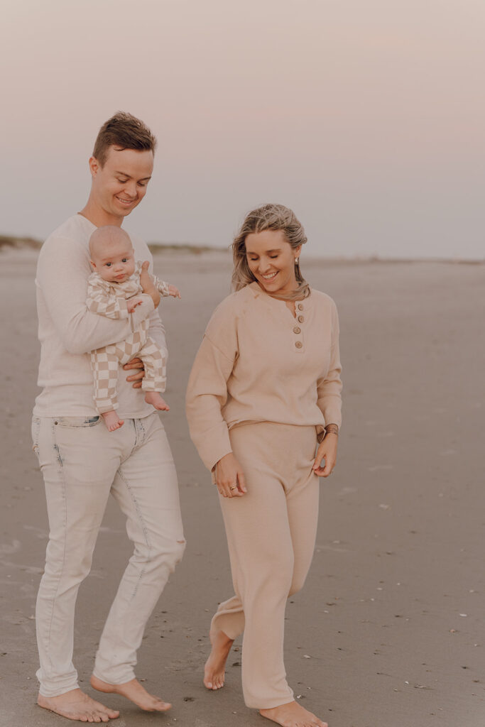 candid sunset beach newborn photos in South Carolina