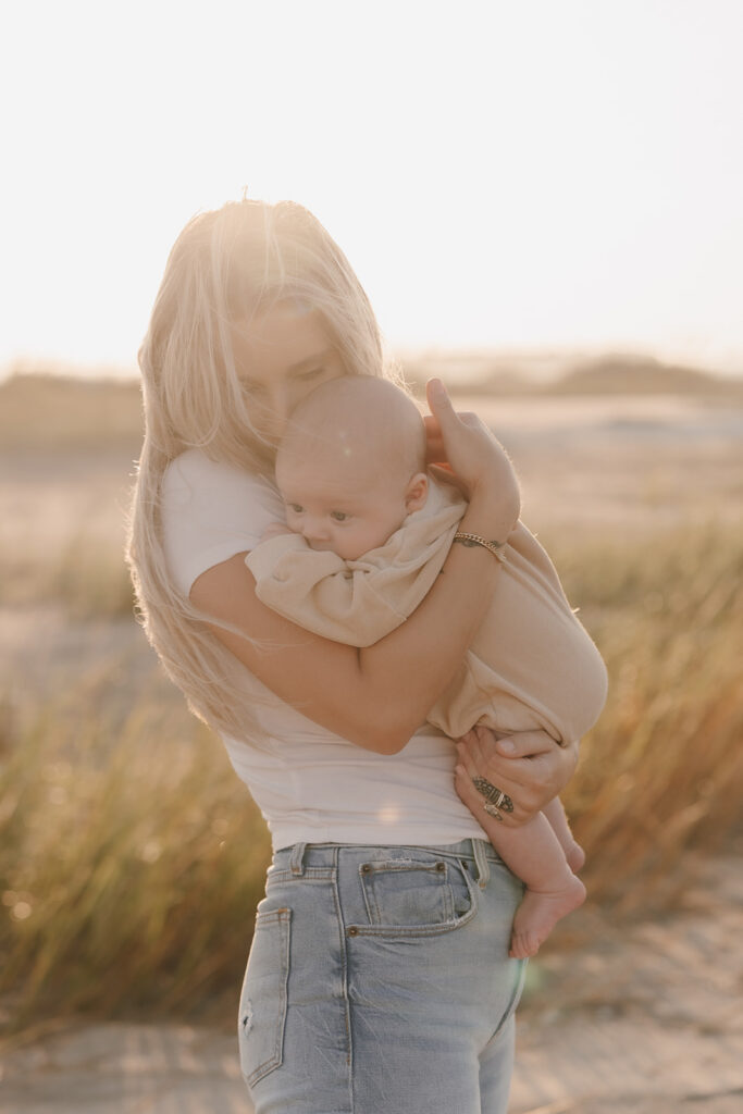 candid newborn photos at the beach in charleston