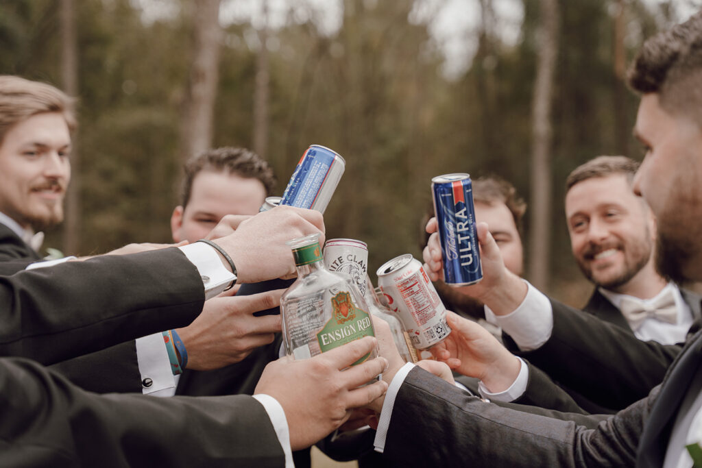 groomsmen toasting with beers
