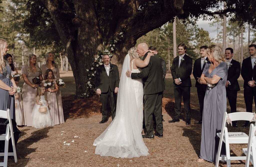 dad giving away daughter for wedding ceremony