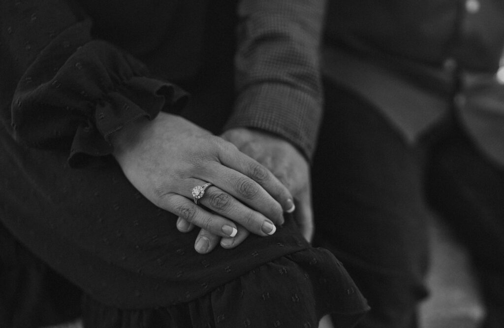 couple watching the sunset to celebrate engagement