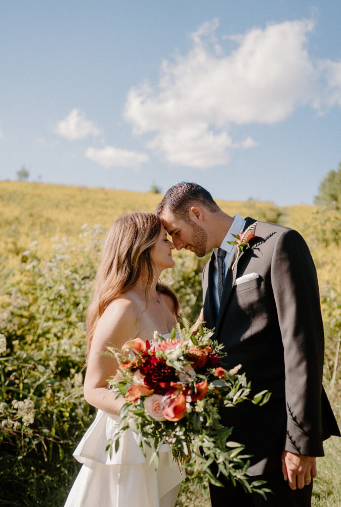 playful and romantic field wedding photos outdoor bride and groom portraits