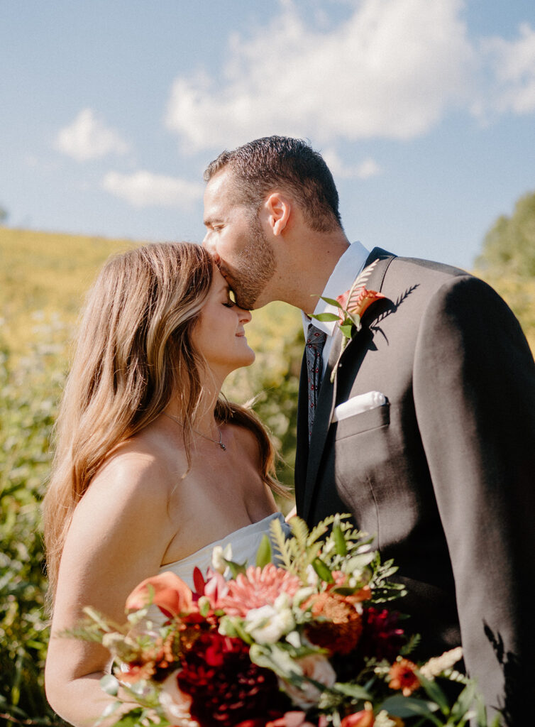 playful and romantic field wedding photos outdoor bride and groom portraits