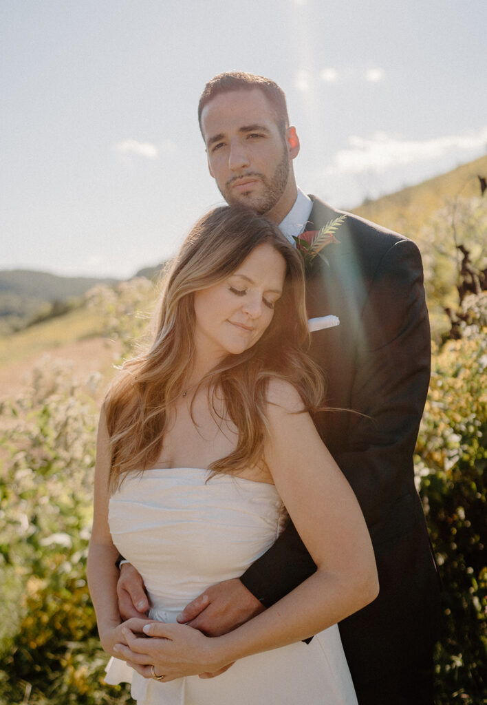 playful and romantic field wedding photos outdoor bride and groom portraits