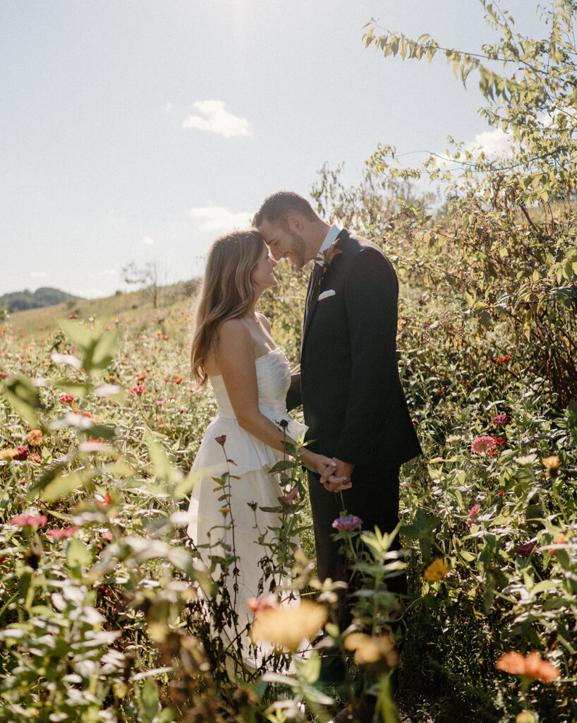 flower field wedding photos with bride and groom romantic