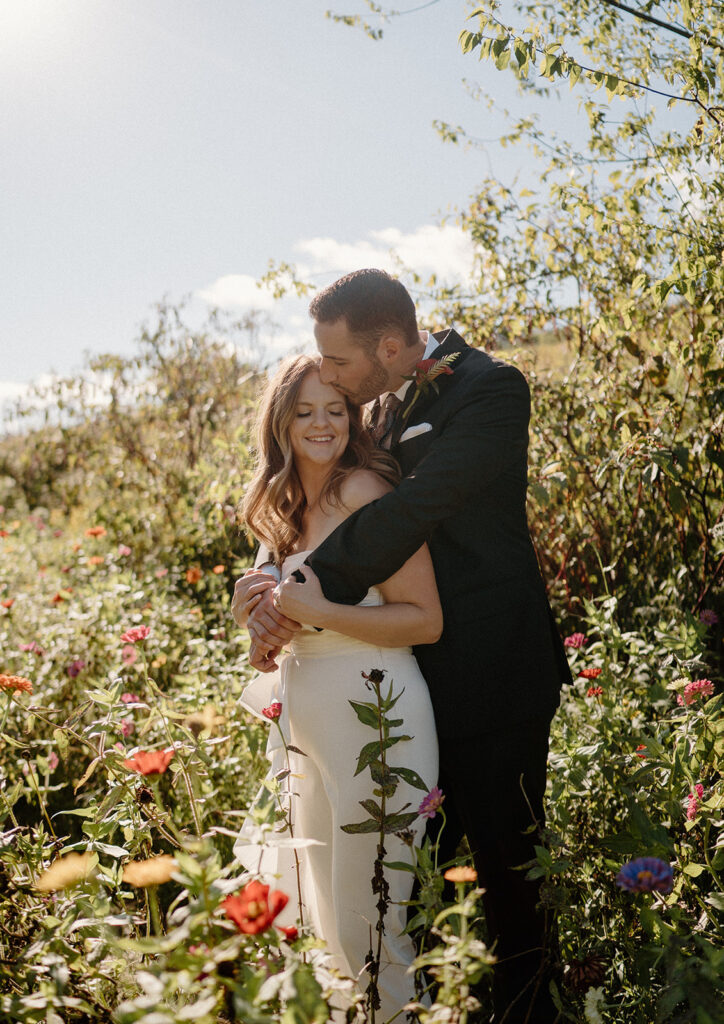 flower field wedding photos with bride and groom romantic