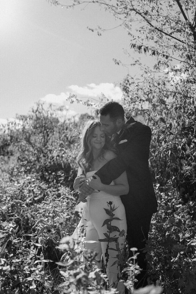 flower field wedding photos with bride and groom romantic
