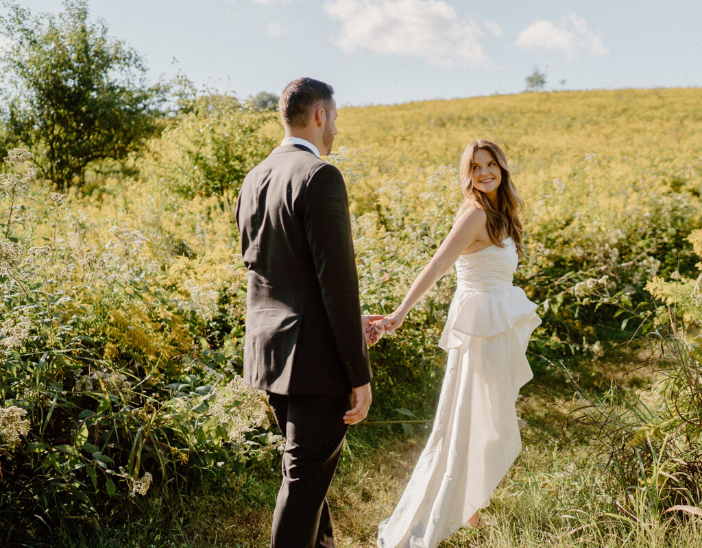 flower field wedding photos with bride and groom romantic