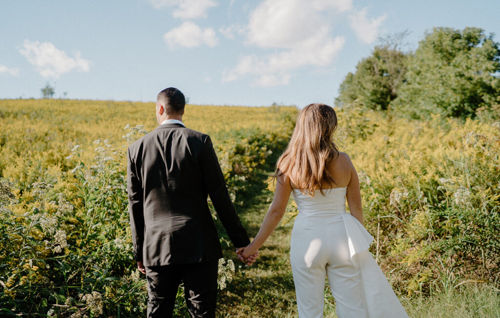 flower field wedding photos with bride and groom romantic