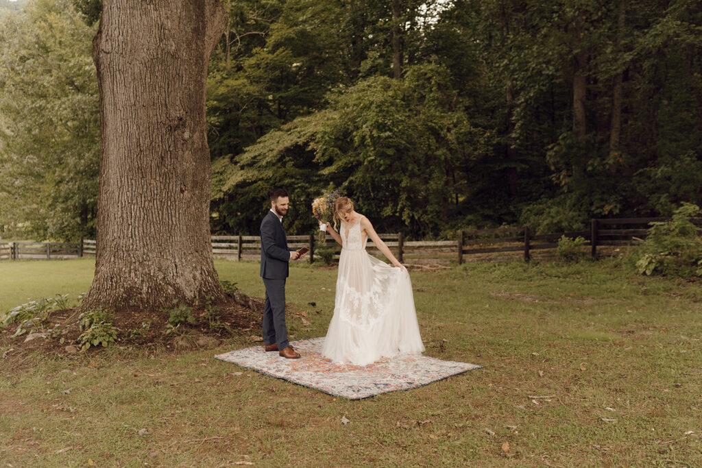 first look with bride and groom on vintage rug outdoors