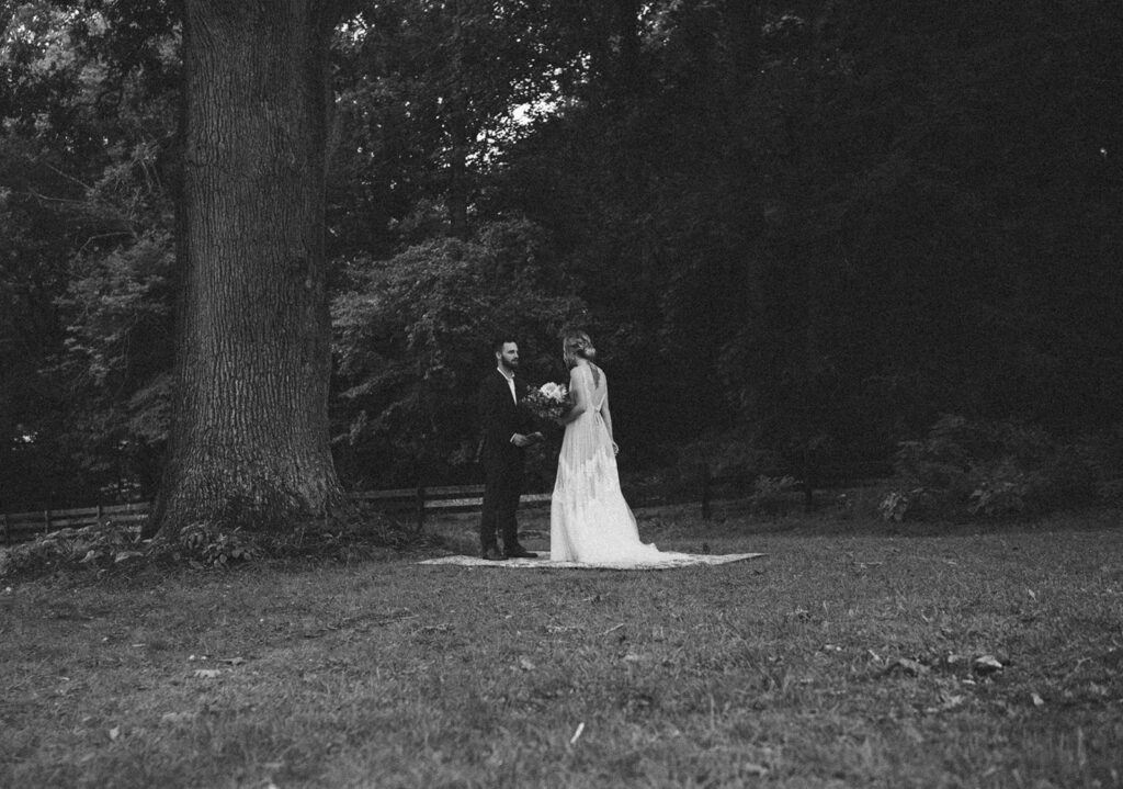 first look with bride and groom on vintage rug outdoors