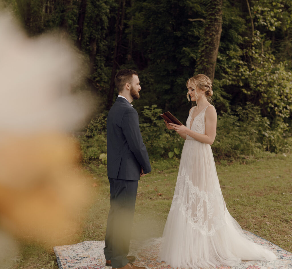 first look with bride and groom on vintage rug outdoors
