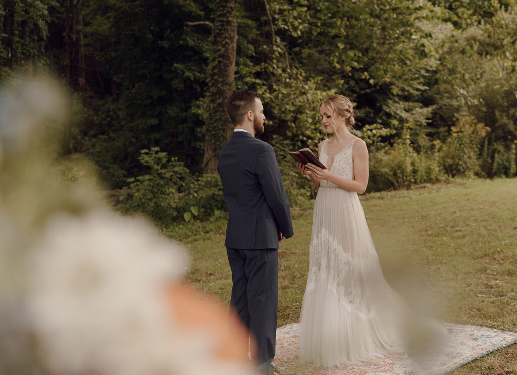 first look with bride and groom on vintage rug outdoors