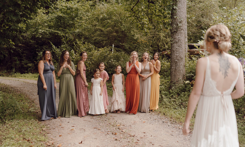first look with bridesmaids fall rustic colors