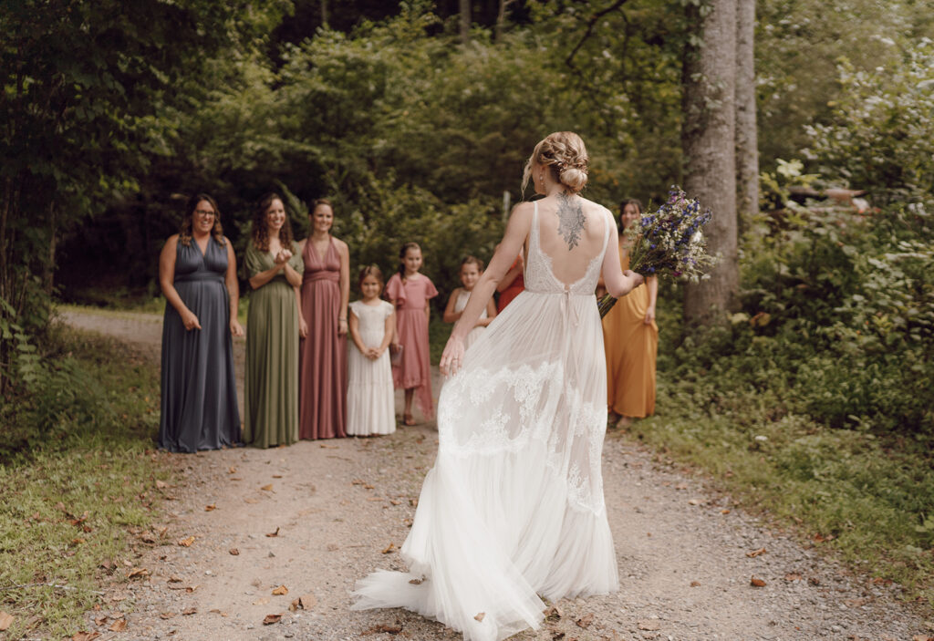 first look with bridesmaids fall rustic colors