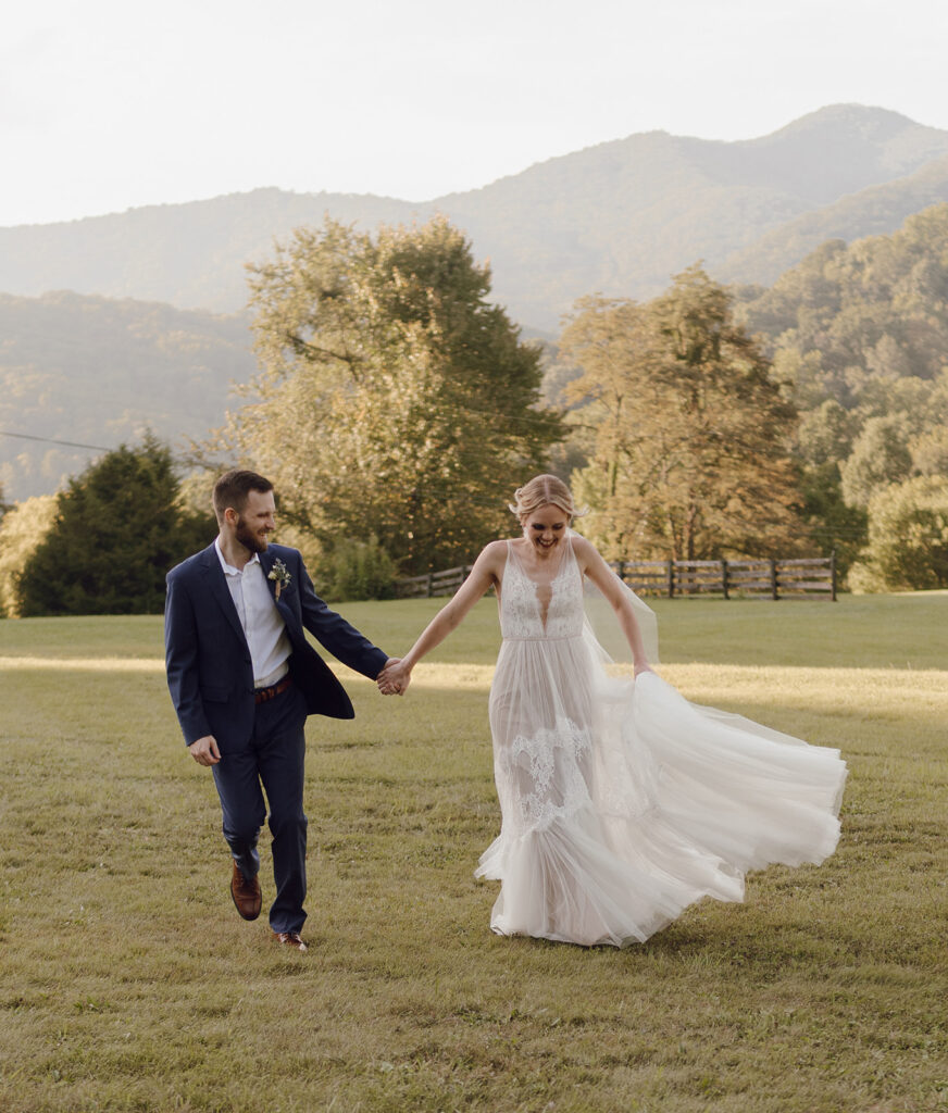 romantic bride and groom wedding photos in front of the mountains at the fields of blackberry cove