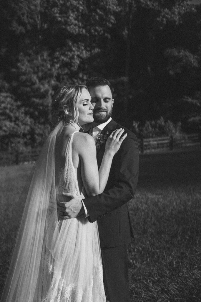 golden hour wedding portraits with bride and groom at the fields of blackberry cove
