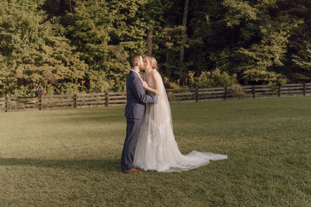 golden hour wedding portraits with bride and groom at the fields of blackberry cove
