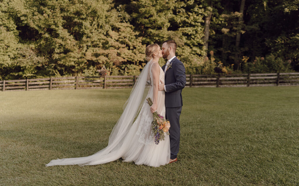 golden hour wedding portraits with bride and groom at the fields of blackberry cove