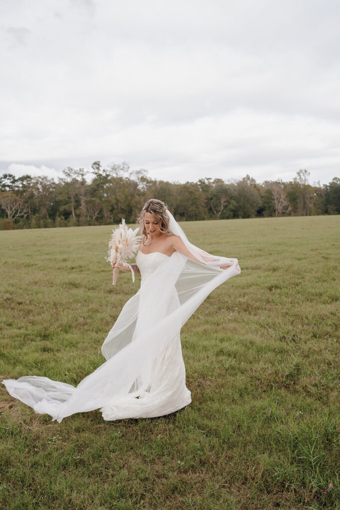 outdoor bride and groom portraits in a field