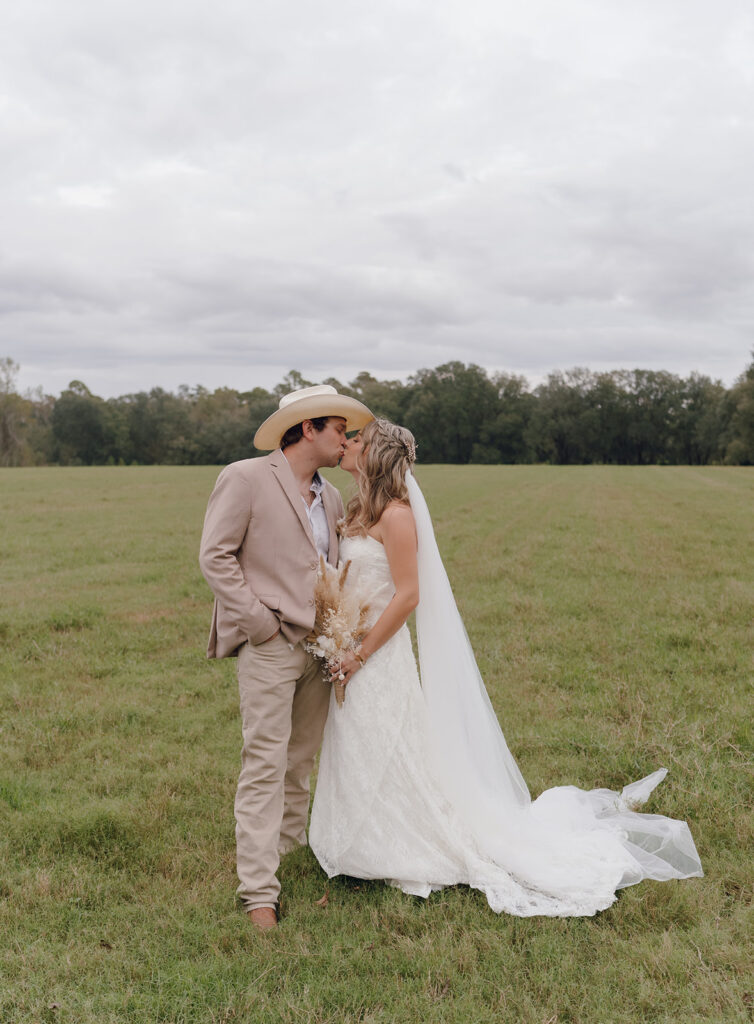outdoor bride and groom portraits in a field