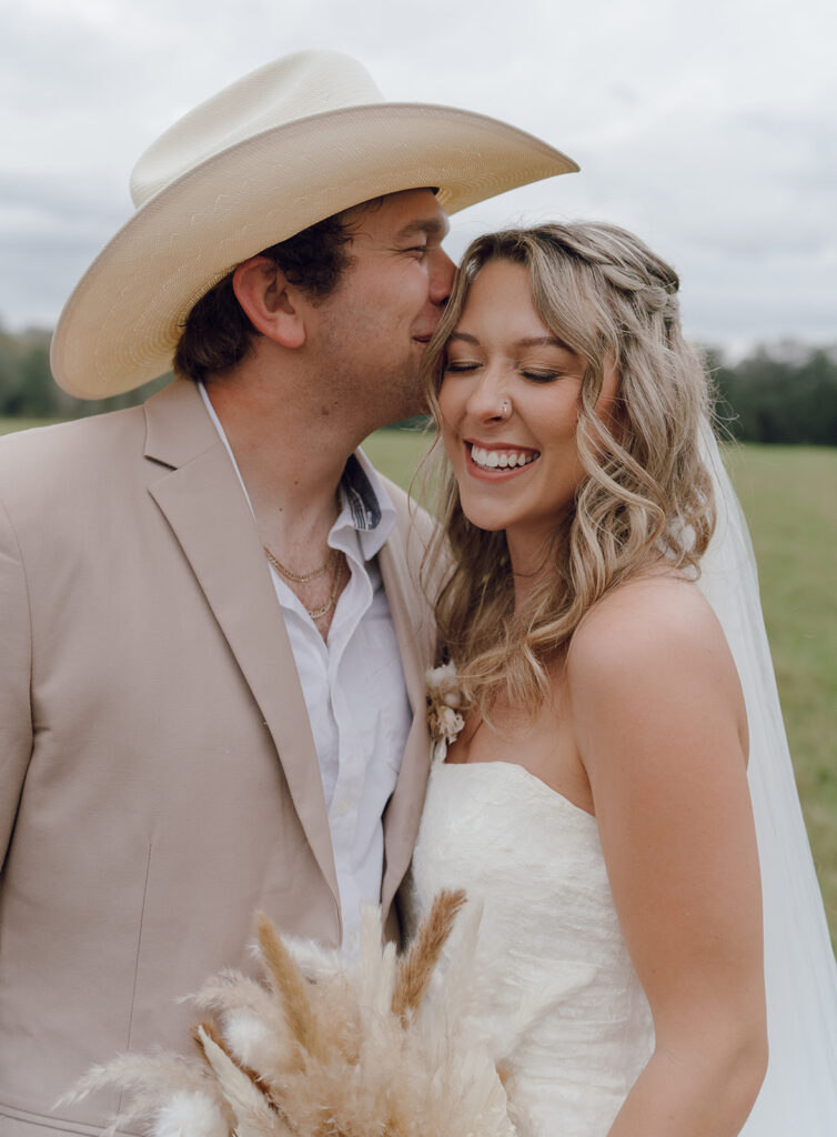 outdoor bride and groom portraits in a field